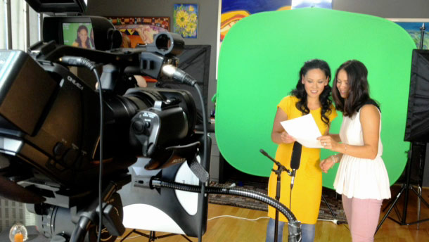 Sisters in front of portable green screen