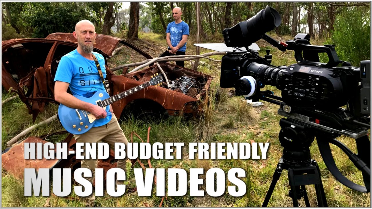 2 band members in the Australian bush with a burnt out car posing for a music video.